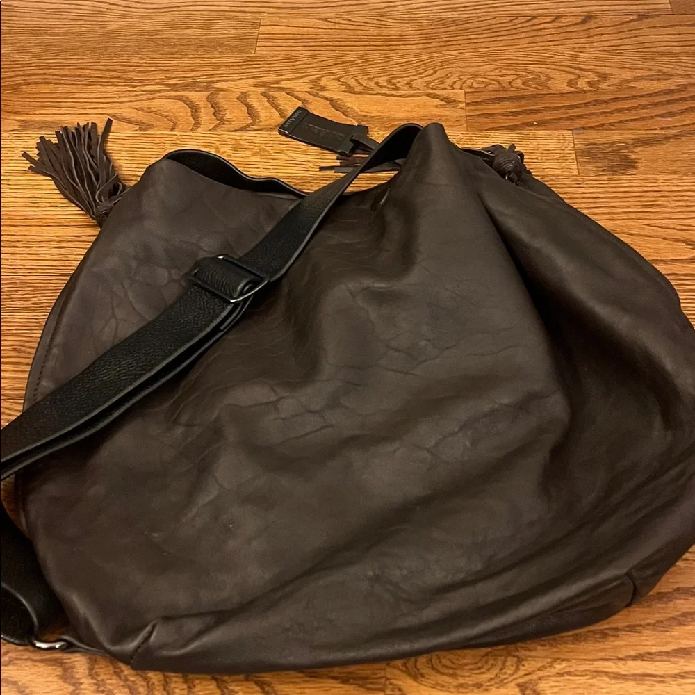DanAzan slouchy one shoulder bag in brown leather with black adjustable strap